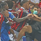 Marseille’s French midfielder Dimitri Payet (2nd L) reacts as players from OGC Nice and Olympique de Marseille stop a fan invading the pitch trying to kick Payet during a French L1 football match.